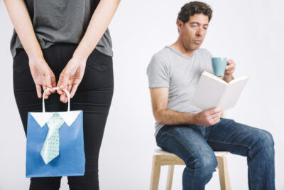 crop woman making surprise reading father